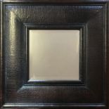 A FAUX CROCODILE SKIN LEATHER FRAMED MIRROR With central bevelled plate. (71cm x 71cm)