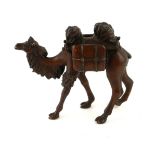 AN ORIENTAL BRONZE CAMEL SCULPTURE Cast with two saddlebags, bearing square seal mark to base. (