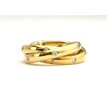 AN 18CT GOLD AND DIAMOND SET RUSSIAN TRIPLE WEDDING BAND. (12.7g)