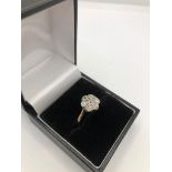 A LATE VICTORIAN 18CT GOLD AND OLD CUT DIAMOND DAISY CLUSTER RING (size P ½). (diamonds approx 0.