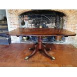 A 19TH CENTURY MAHOGANY TILT TOP BREAKFAST TABLE The rectangular top raised on a termed column