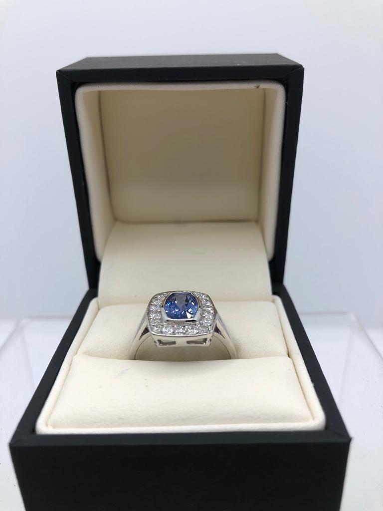 AN 18CT WHITE GOLD, SAPPHIRE AND DIAMOND RING (size O). (sapphire approx 1.80ct, diamond approx 0. - Image 3 of 3