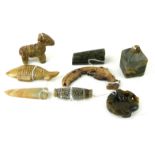 A COLLECTION OF EIGHT CARVED HEITAN JADE PENDANTS In the style of the ancient and Qing, including