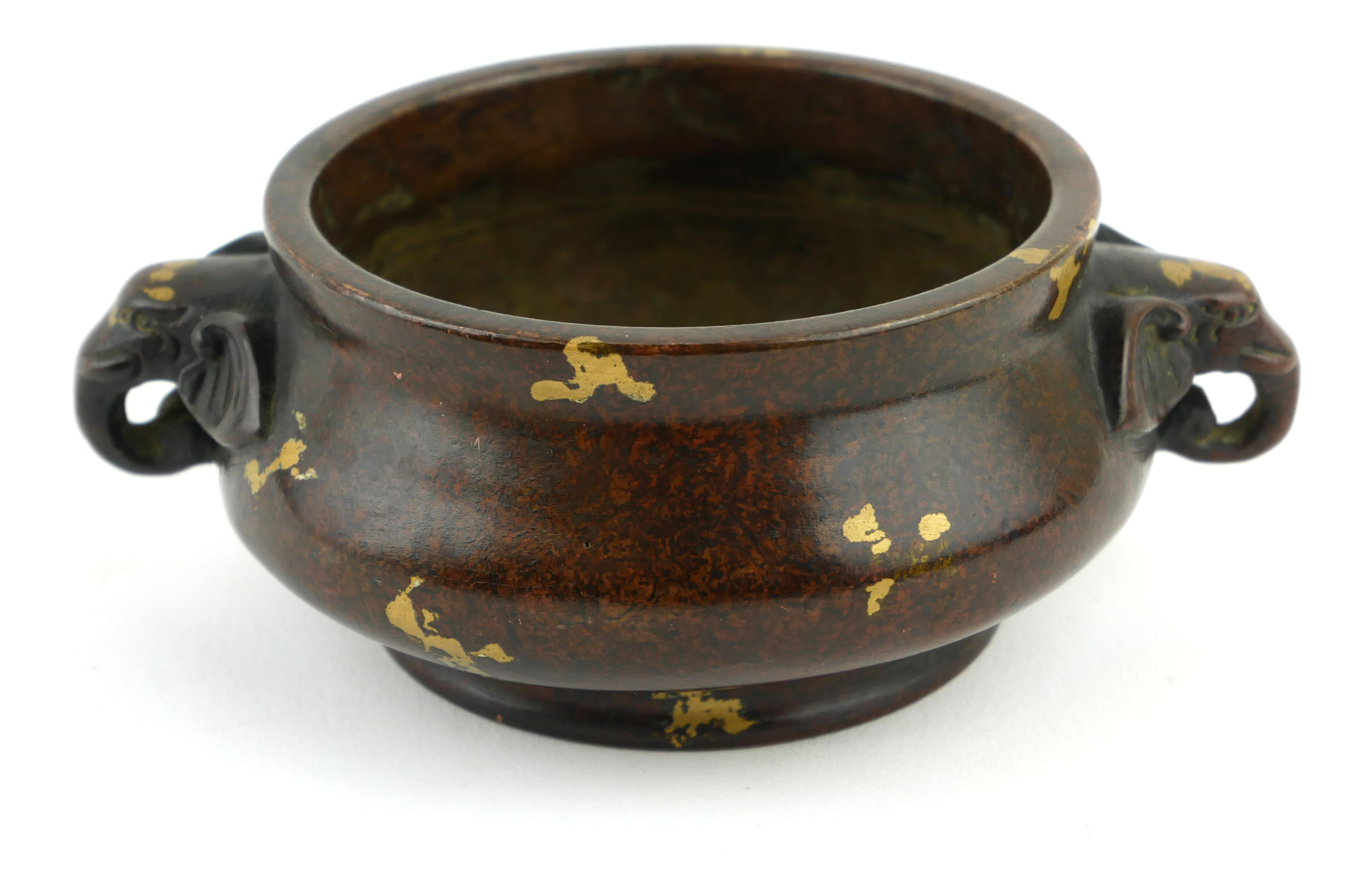 A CHINESE BRONZE CENSER WITH DOUBLE ELEPHANT MASK HANDLES Gilt splash decoration and square