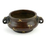 A CHINESE BRONZE CENSER WITH DOUBLE ELEPHANT MASK HANDLES Gilt splash decoration and square