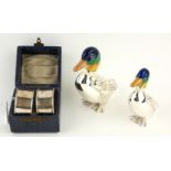 TWO WHITE METAL AND ENAMEL DUCK STATUES Having green and blue enamel decoration and embossed