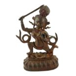 AN INDIAN BRONZE GODDESS WARRIOR STATUE Clutching a serpent and spear, kneeling on a figure of
