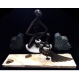 AN ART DECO SPELTER AND MARBLE PHOTOGRAPH STAND With peacock figure and being marble base,