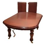 A GOOD QUALITY SOLID MAHOGANY VICTORIAN DESIGN WINDUT DINING TABLE Complete with two extra leaves,