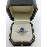 A 14CT GOLD TANZANITE AND DIAMOND RING (size N½). (tanzanite approx 1.50ct, diamond approx 0.50ct)