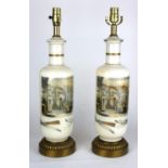 A PAIR OF REVERSE GLASS DECORATED MILK GLASS TABLE LAMPS Industrial interior scenes, on bronze