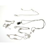 A COLLECTION OF FOUR VINTAGE WHITE METAL AND PASTE SET NECKLACES Two having single oval cut