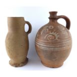 A 16TH CENTURY SIEGBURG SALT GLAZE POTTERY JUG With concentric rings to body, together with a