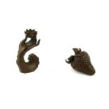 TWO JAPANESE BRONZE MINIATURE SCULPTURES, A HAND HOLDING A LOTUS FLOWER AND A STRAWBERRY. (approx