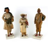 A SET OF THREE 19TH CENTURY INDIAN HAND PAINTED CLAY FIGURES Hand painted, wearing Indian