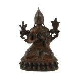 A CHINESE BRONZE BUDDHA STATUE Seated pose with two floral adornments and double lotus base. (approx