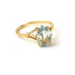 AN 18CT GOLD AND AQUAMARINE RING (size P). (2.4g) Condition: good
