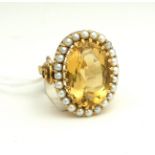 A CONTINENTAL 18CT GOLD, LARGE CITRINE AND SEED PEARL COCKTAIL RING. (2.2cm, 11g)