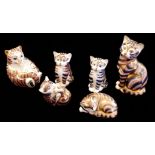 ROYAL CROWN DERBY, A COLLECTION OF SIX PORCELAIN CAT PAPERWEIGHTS Decorated in the Imari palette,