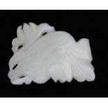 A CHINESE CARVED JADE GOLDFISH Pierced decoration of leaves. (approx 6.5cm) Condition: good overall,