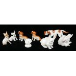 ROYAL VIENNA, A COLLECTION OF EIGHT PORCELAIN FIGURES Five dogs one standing pose, two rabbits and a