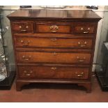 AN 18TH CENTURY OAK AND MAHOGANY CROSS BANDED CHEST Three short above three long drawers, with brass