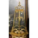 A LARGE POLISHED BRASS LANTERN The hexagonal tapering etched glazed panels above swags, shell and