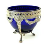A LATE 19TH/EARLY 20TH CENTURY GERMAN SILVER AND BLUE GLASS SUGAR BOWL Classical form, with floral