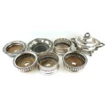 A PAIR OF EDWARDIAN SILVER PLATED WINE COASTERS Along with four 19th Century versions and a heavy