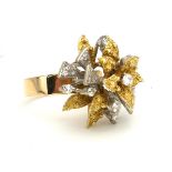 A 14CT GOLD AND DIAMOND DRESS RING OF ORGANIC FORM (size Q). (11.1g)