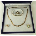 A VINTAGE 14CT GOLD AND OPAL JEWELLERY SUITE Comprising a necklace, ring and earrings each set