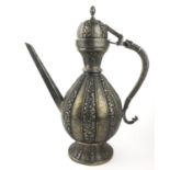 A LARGE PERSIAN WHITE METAL TEAPOT Having a dome form lid with lion mask handle and fine embossed