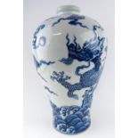 A CHINESE BLUE AND WHITE PORCELAIN DRAGON VASE With a four toe dragon chasing a flaming pearl within