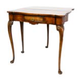 AN 18TH CENTURY FIGURED WALNUT FOLD OVER TEA TABLE The shaped top over a single drawer, raised on