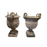 A LARGE PAIR OF DECORATIVE 19TH CENTURY CARVED STONE TWIN HANDLED URNS With facial mask of Serapis