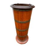 A 19TH CENTURY TEAK AND BRASS BOUND CYLINDER STICK STAND WITH LEAD LINER. H70cm D30cm
