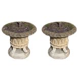 A LARGE PAIR OF HADDONSTONE STONE GARDEN POTS With lattice decorations, raised on paw feet