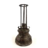 AN EARLY 18TH CENTURY PRIMITIVE IRON AND WOODEN CANDLESTICK. (21.5cm) Condition: base has old