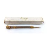 AN EARLY 20TH CENTURY GOLD PLATE AND AMETHYST PROPELLING FOUNTAIN PEN Set with a single round cut