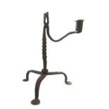 AN 18TH CENTURY WROUGHT IRON RUSH LIGHT Single scones, twist column, three splayed legs, pad