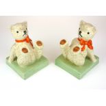 CLARICE CLIFF, A PAIR OF NURSERY BOOKENDS MODELLED AS A TEDDY BEAR, CIRCA 1929 - 1935 Painted in