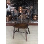 A 19TH CENTURY ASH AND ELM WINDSOR WHEEL BACK OPEN ARMCHAIR. (52cm x 39cm x 87cm) Condition: some