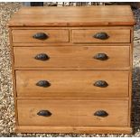 A VICTORIAN WAXED PINE CHEST OF TWO SHORT ABOVE THREE LONG DRAWERS.