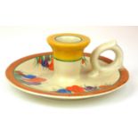 CLARICE CLIFF, BIZARRE RANGE, A SINGLE HANDLED POTTERY CHAMBERSTICK In 'Crocus' pattern, painted