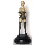 MISS WHIPLASH, AN ART DECO STYLE BRONZE AND IVORINE STATUE On a marble base. (33cm) Condition: good