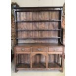 A GEORGIAN OAK AND PINE DRESSER With shelves above three drawers and pot shelf. (140cm x 41cm x