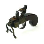 AN ANTIQUE WALNUT AND BRASS PISTOL GRIP FLINT STRIKE TINDERBOX LIGHTER. (13cm) Condition: good, in