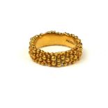 STUART DEVLIN, AN 18CT GOLD BUBBLE BAND RING (size N/O). Condition: good