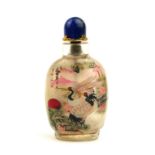 A CHINESE REVERSE PAINTED GLASS AND LAPIS LAZULI SNUFF BOTTLE Decorated with a pair of exotic birds,