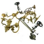 A COLLECTION OF ANTIQUE BRASS LIGHT FITTINGS To include a pairing scroll arm sconces, adjust gas